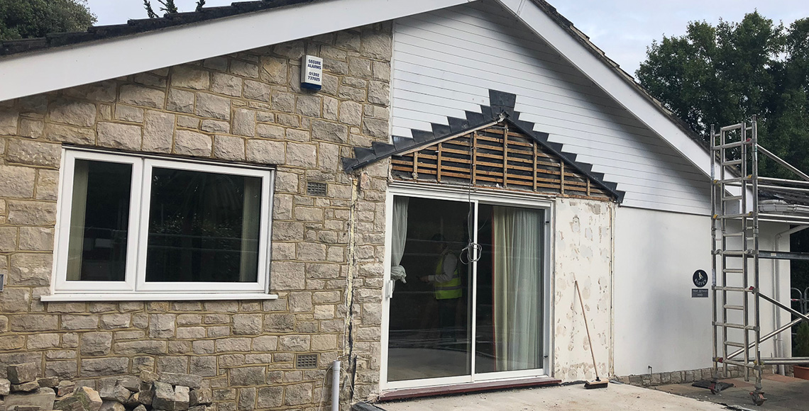 Bungalow in Branksome, Poole in the process of refitting exterior brickwork. A project by INKSPACE Architects and Interior Designers
