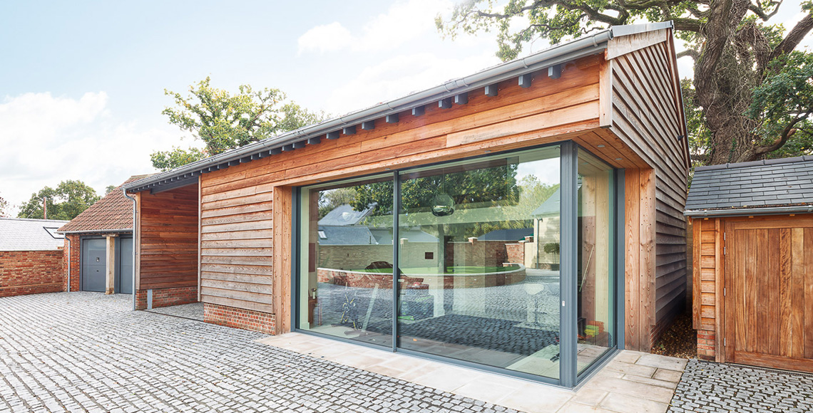 A renovated conservatory in Ellingham Barns - a three-barn conversion project in Dorset, by INKSPACE Architects and Interiors