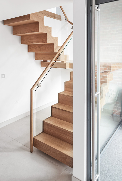 Interior view of staircase in Ellingham Barns - a barn conversion project in Dorset, by INKSPACE Architects and Interior