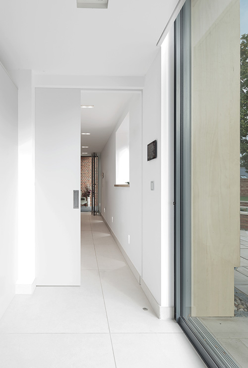 Refurbished hallway inside Ellingham Barns - a barn conversion project in Dorset, by INKSPACE Architects and Interior
