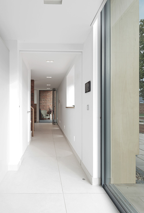 Refurbished hallway inside Ellingham Barns - a barn conversion project in Dorset, by INKSPACE Architects and Interior