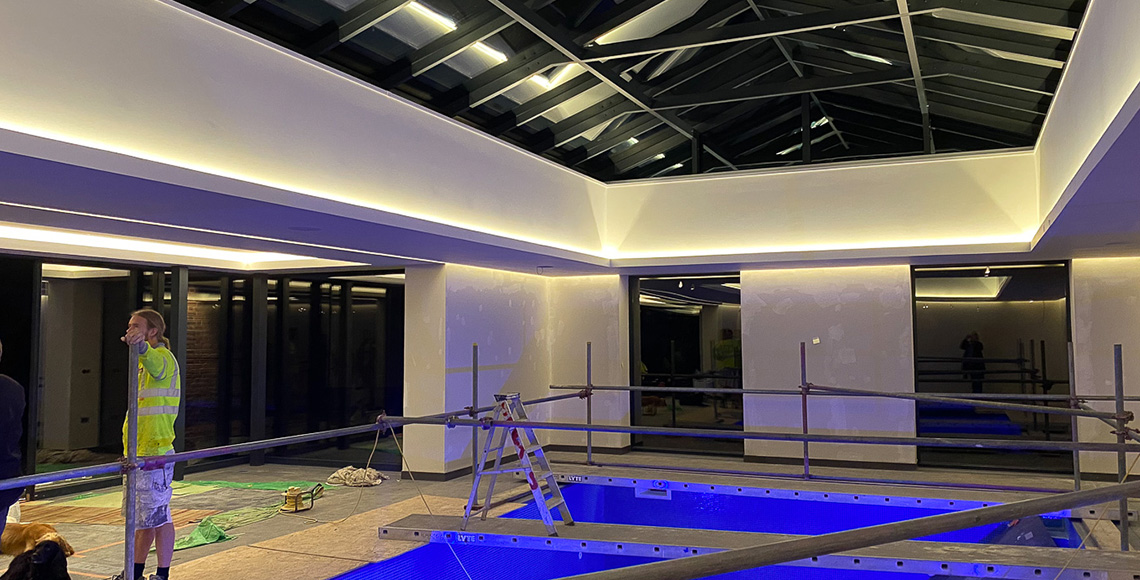 A gym building and pool under construction in the New Forest National Park area. A renovation and reconstruction project by INKSPACE Architects and Interior Designers
