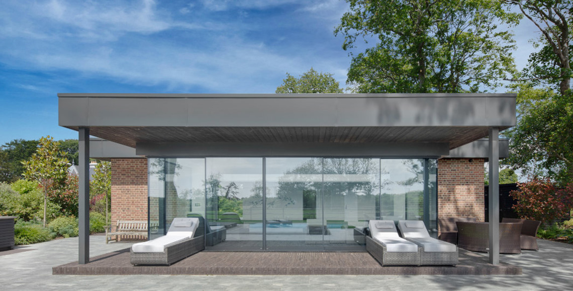 Garden view of Pool House in the New Forest National Park area redesigned by INKSPACE Architects and Interior Designers