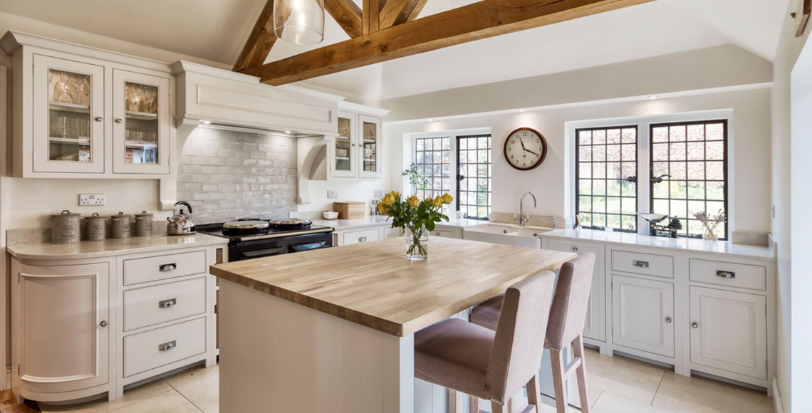 Luxury kitchen / dining area, with wooden ceiling beams, designed by INKSPACE, Interior Designers in Dorset, Devon and Cornwall