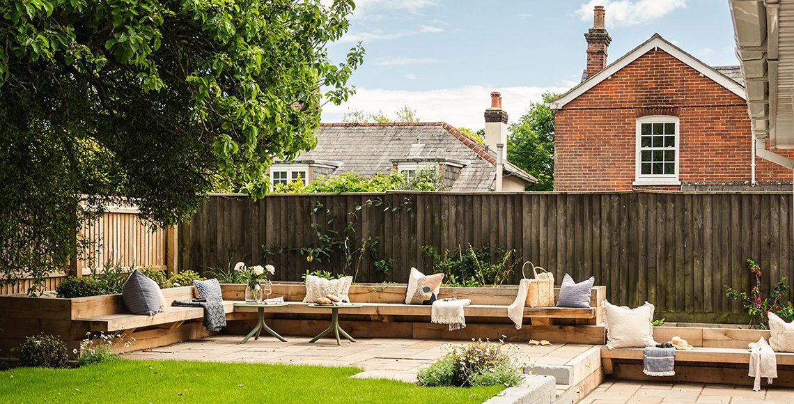 Garden with outdoor seating area in Little Garth, designed by INKSPACE Architects and Interior Designers in Dorset, Cornwall and Devon.