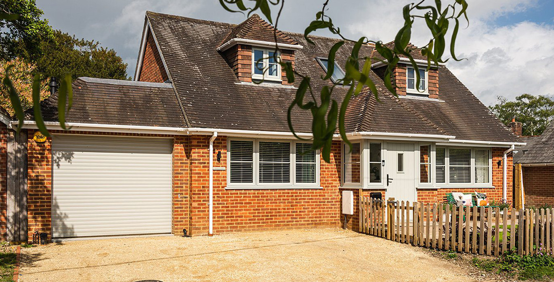 House with garage and driveway in Little Garth, designed by INKSPACE Architects and Interior Designers in Dorset, Cornwall and Devon.