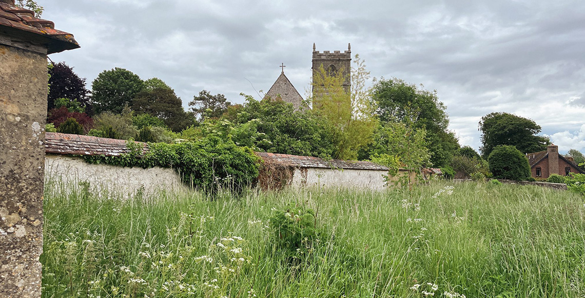 Grade II listed outhouse, planning permission approved for conversion to artist workshop and store, view of listed church