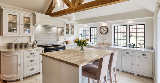 Luxury kitchen / dining area, with wooden ceiling beams, designed by INKSPACE, Interior Designers in Dorset, Devon and Cornwall
